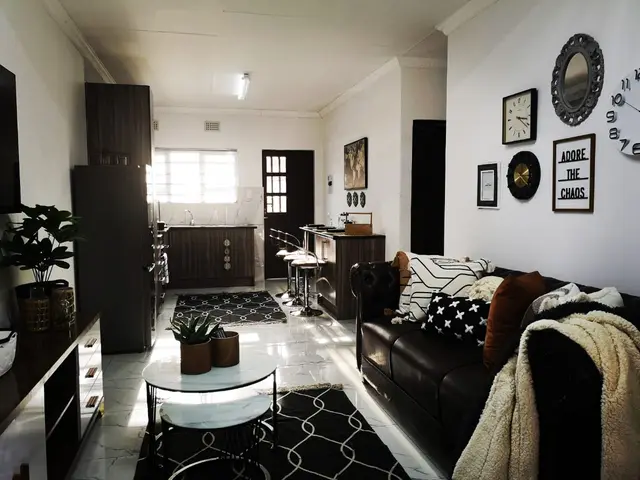 Bright open-plan living space with kitchen and lounge in a corporate unit