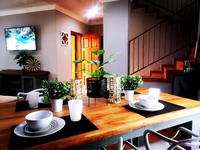 Styled dining room and staircase in a luxury accommodation unit in Burgersfort