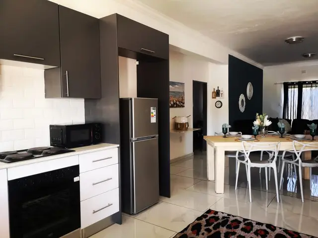Modern kitchen and dining area in an overnight accommodation unit in Burgersfort